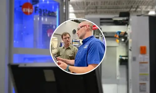 Machinists collaborate on production floor