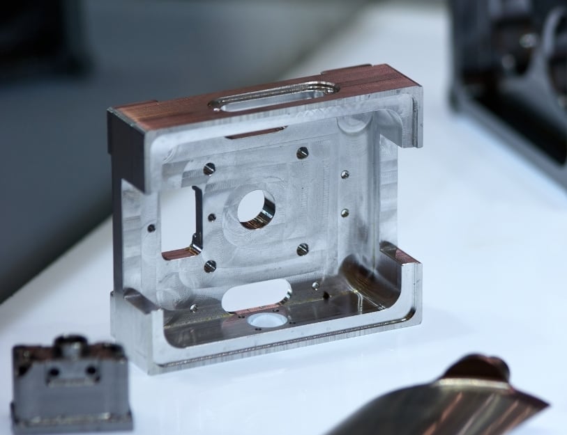 A finished part sits on a work bench