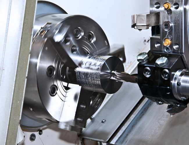 CNC lathe cutting tool makes contact with workpiece