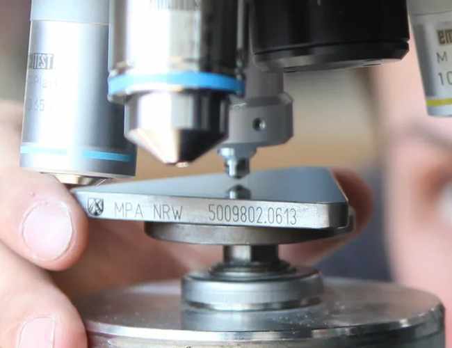 Engineer tests metal hardness with Vickers process